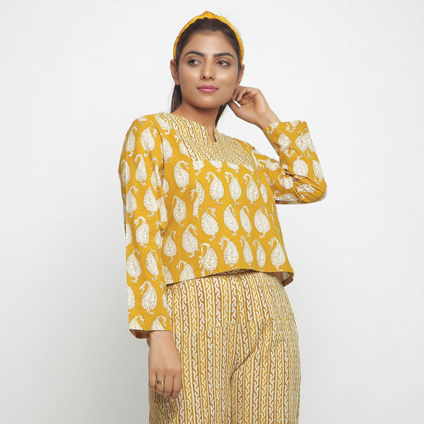 Right View of a Model wearing Mustard Bagru Block Printed High-Low Cotton Top