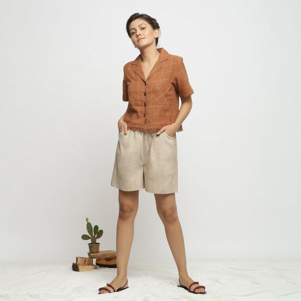 Front View of a Model wearing Beige Dabu Print Cotton Flared Shorts