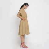 Right View of a Model wearing Beige Deep Neck Bohemian Frilled Dress