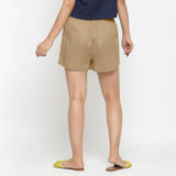 Back View of a Model wearing Beige Solid Cotton Short Shorts