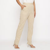 Right View of a Model wearing Beige Yarn Dyed Mid Rise Tapered Pant