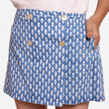 Front Detail of a Model wearing Blue Block Printed Button-Down Skirt