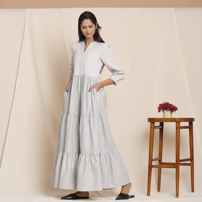 Left View of a Model wearing Cloudy Grey Striped Floor Length Cotton Tier Dress
