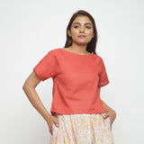 Front View of a Model wearing Brick Red Boat Neck Half Sleeve Cotton Top