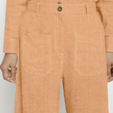 Front Detail Of a Model wearing Desert Yellow Linen Patch Pocket Wide Legged Pant