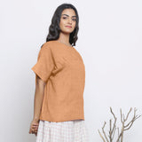Right View of a Model wearing Desert Yellow Round Neck Linen Yoked Top