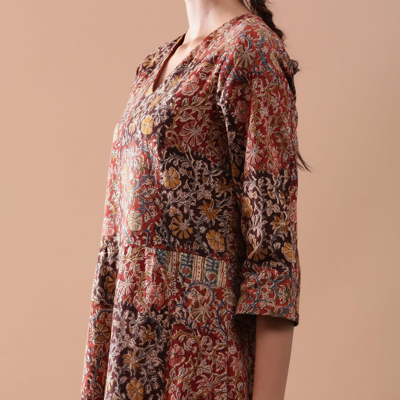 Left Detail of a Model wearing Warm Block Printed Muddy Red Cotton Midi Dress