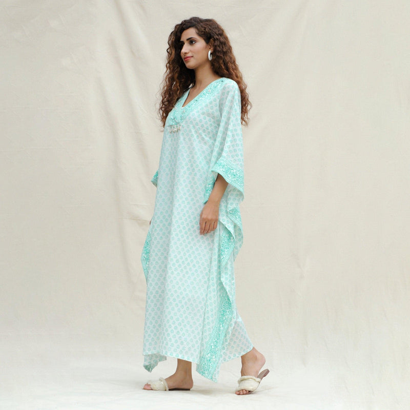 Right View of a Model wearing Green Floral Block Printed Cotton Maxi Kaftan Dress