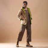 Right View of a Model wearing Green Reversible Detachable Hoodie Quilted Cotton Jacket