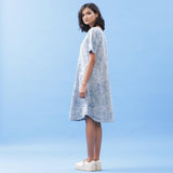 Left View of a Model wearing Blue Dabu Hand Lep Print Cotton Knee Length Dress