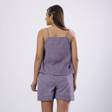 Back View of a Model wearing Lavender 100% Linen Flared Relaxed Camisole Top