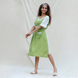 Left View of a Model wearing Light Green Cotton Flax Comfort Fit Apron
