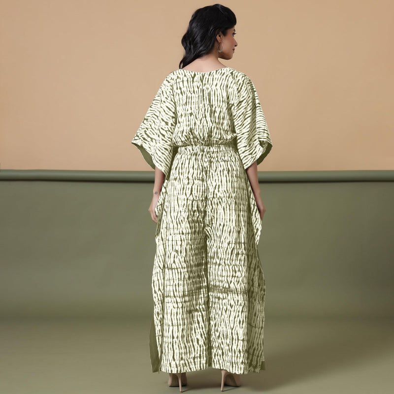 Back View of a Model wearing Light Green Shibori V-Neck Cotton Kaftan Jumpsuit