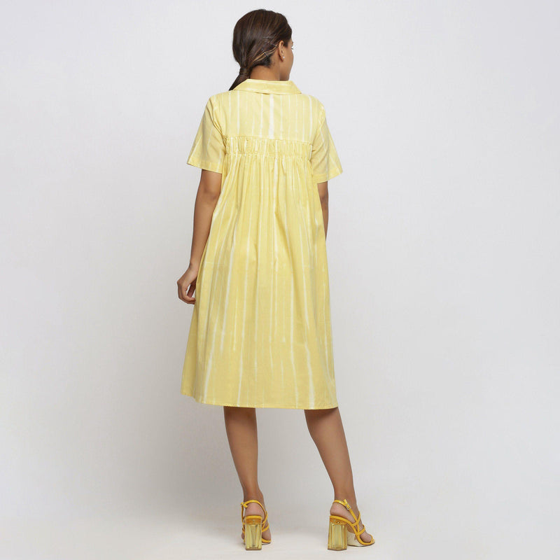Back View of a Model wearing Light Yellow Tie And Dye High Low Dress