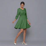Front View of a Model wearing Moss Green V-Neck Corduroy Dress