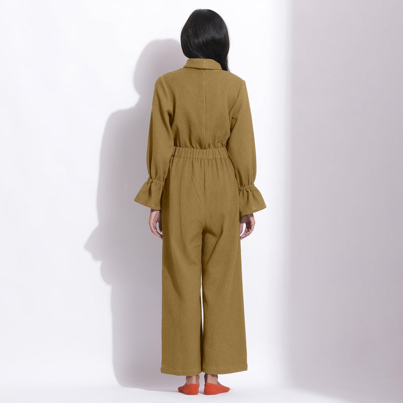 Back View of a Model wearing Olive Green Cotton Waffle Turtle Neck Overalls