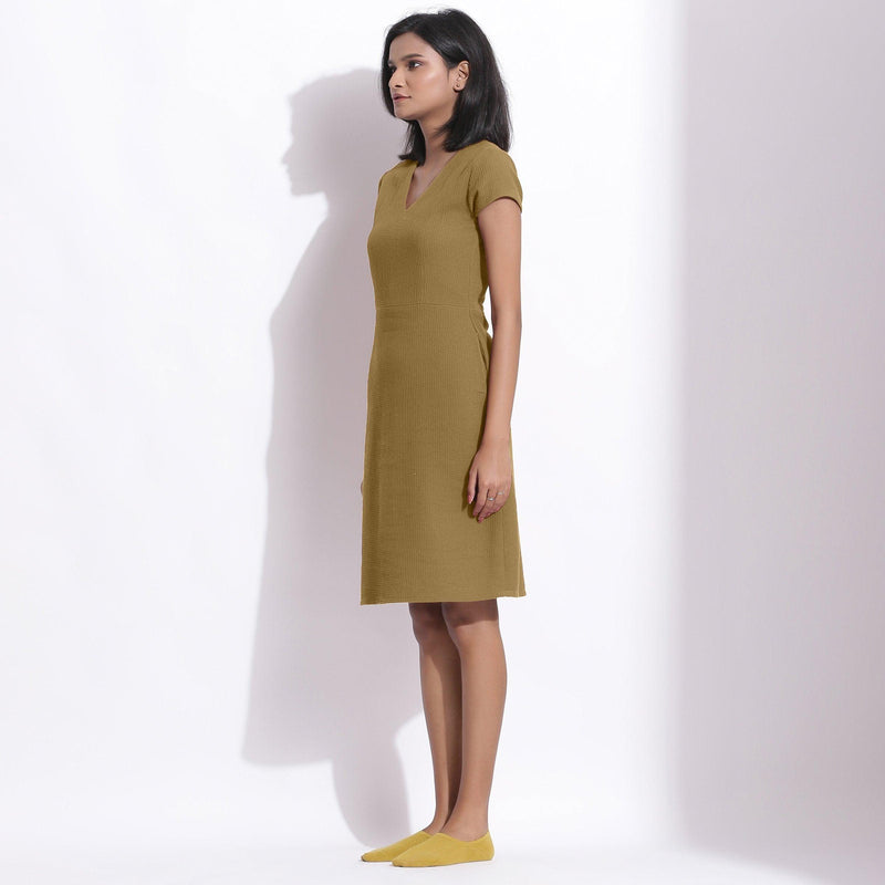 Left View of a Model wearing Olive Green Cotton Waffle V-Neck Dress