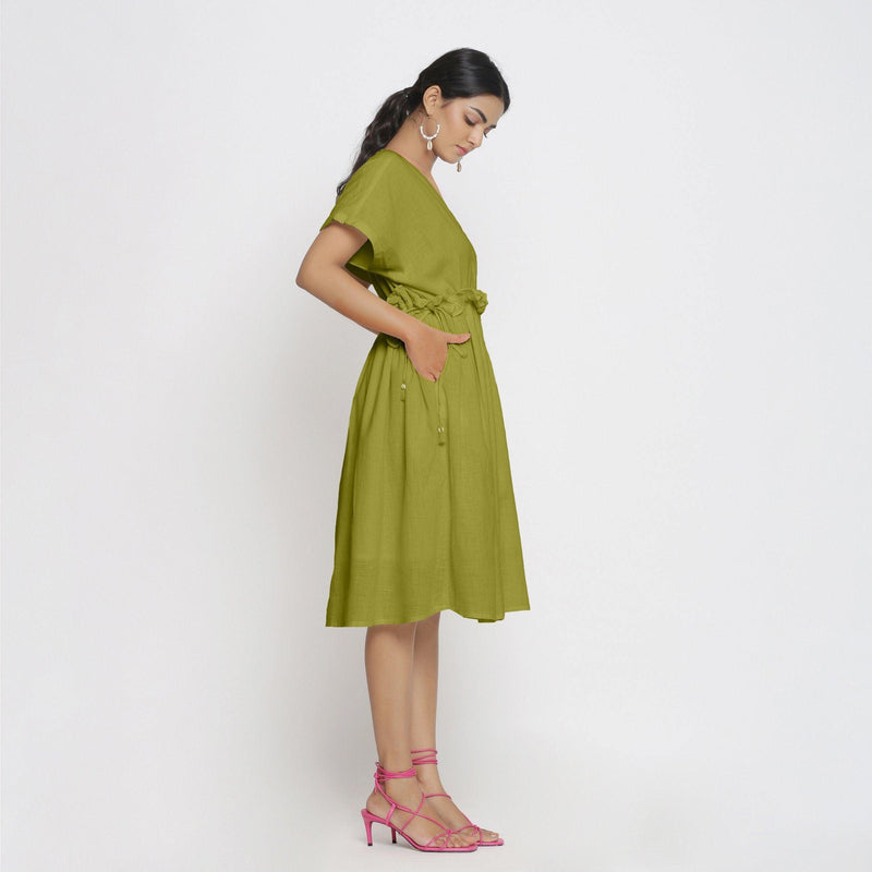Right View of a Model wearing Olive Green Deep Neck Bohemian Frilled Dress