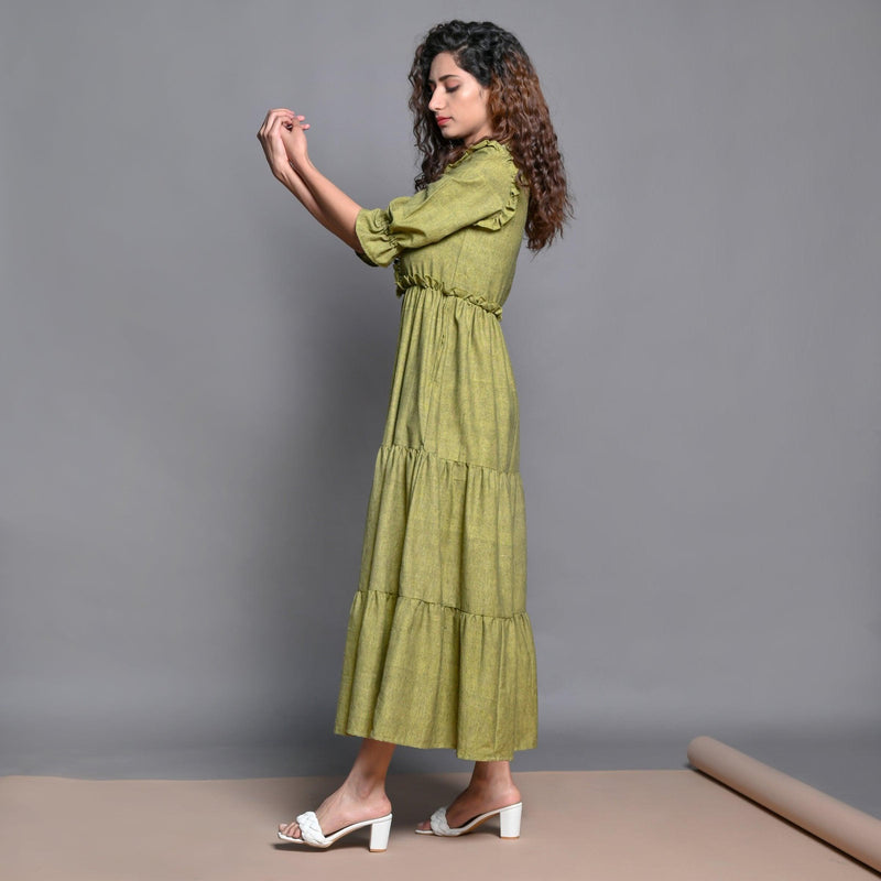 Left View of a Model wearing Olive Green Hand Beaded Handspun Cotton Maxi Boho Dress