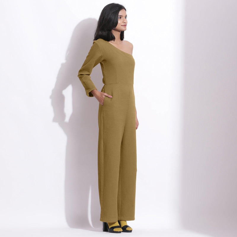 Right View of a Model wearing Olive Green Honeycomb One-Shoulder Jumpsuit