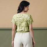 Back View of a Model wearing Olive Green Shibori Button-Down Blouson Top