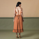 Back View of a Model wearing Orange A-Line Ruffled Cotton Skirt