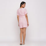 Back View of a Model wearing Pink Ditsy Block Print Cotton Short Romper