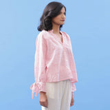 Right View of a Model wearing Pink Hand Block Printed Button-Down Blouse