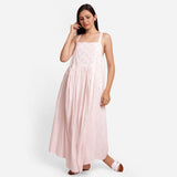 Front View of a Model wearing Powder Pink Cotton Block Print Gathered Maxi Dress