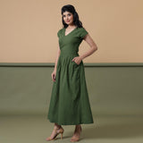 Left View of a Model wearing Reversible Forest Green Tie-Dye Cotton Maxi Wrap Dress