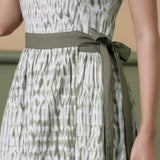 Front Detail of a Model wearing Reversible Shibori Green Wrap Dress