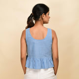 Back View of a Model wearing Sky Blue Handwoven 100% Cotton Peplum Top