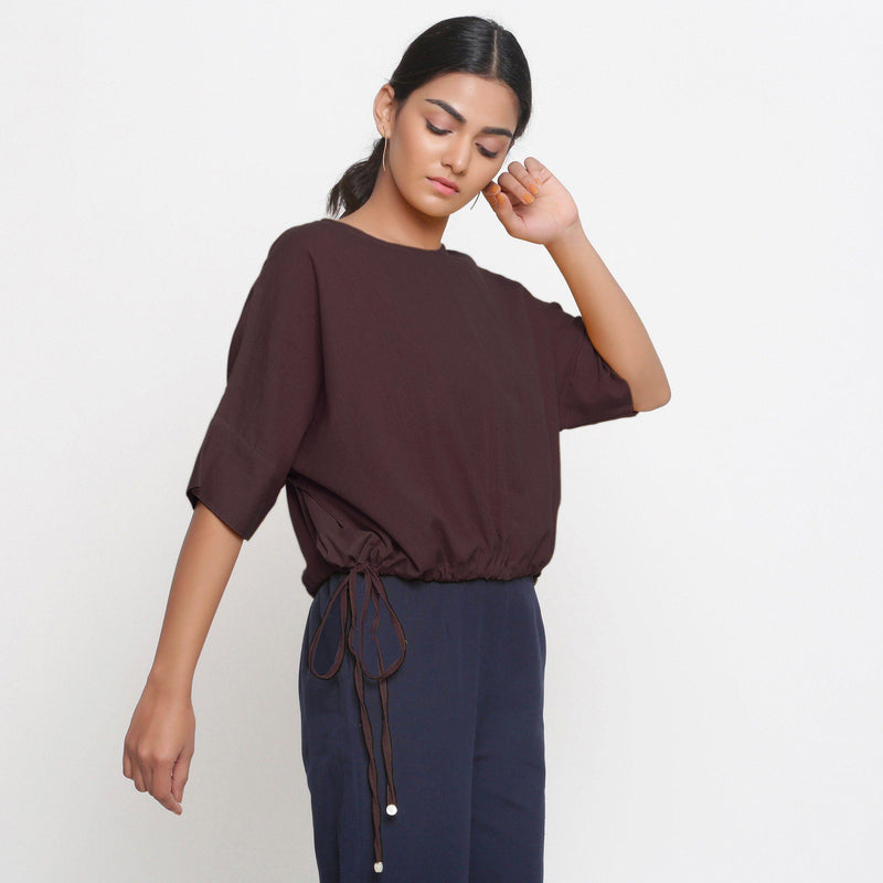 Right View of a Model wearing Solid Brown Cotton Flax Blouson Top