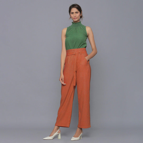 Front View of a Model wearing Sunset Rust Cotton Corduroy Pant