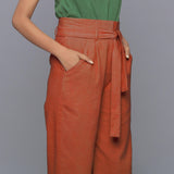 Right Detail of a Model wearing Sunset Rust Cotton Corduroy Pant