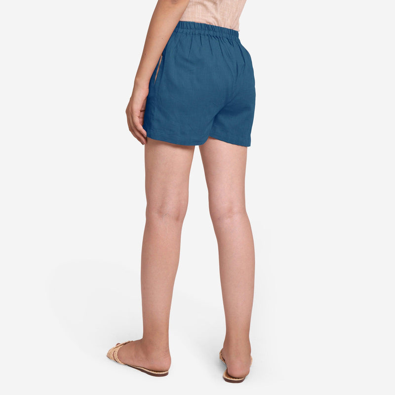 Back View of a Model wearing Teal Mid-Rise Cotton Straight Shorts