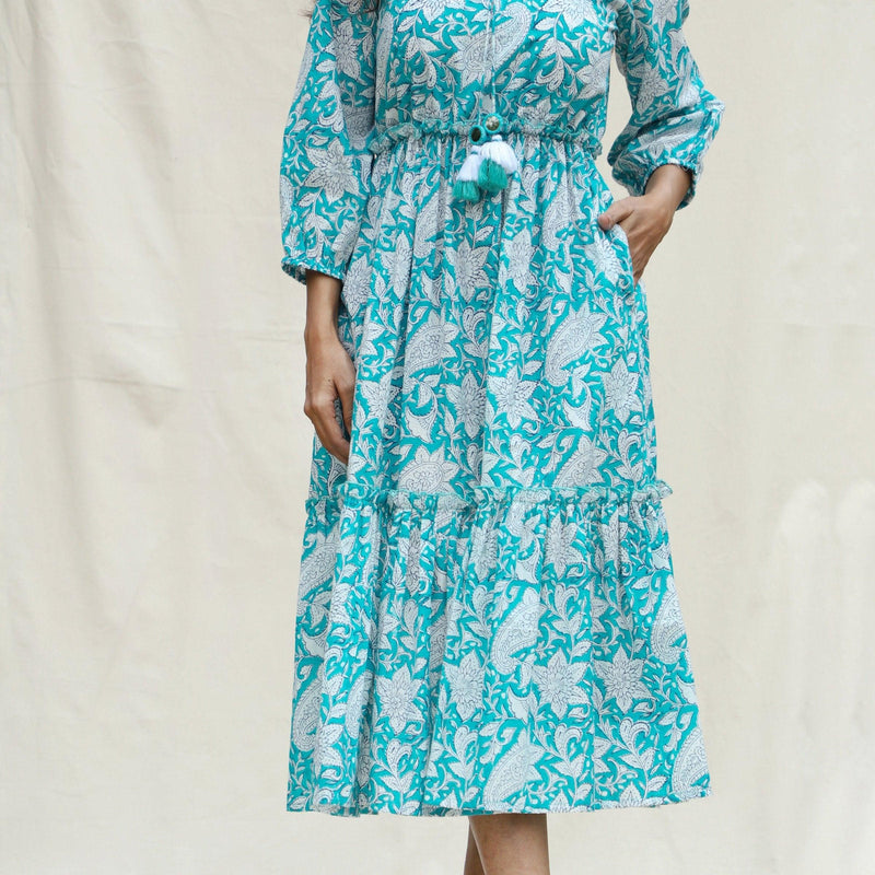 Front Detail of a Model wearing Turquoise Floral Block Printed Cotton Tier Midi Dress