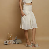 Right View of a Model wearing Undyed Cotton Flax Frilled Skirt