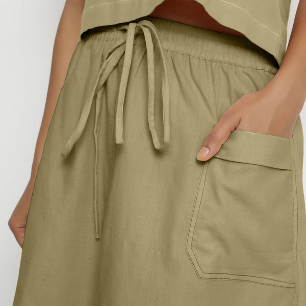 Front Detail of a Model wearing Vegetable-Dyed Green 100% Cotton Mid-Rise Skirt