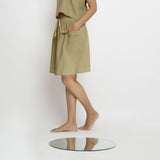 Left View of a Model wearing Vegetable-Dyed Green 100% Cotton Mid-Rise Skirt