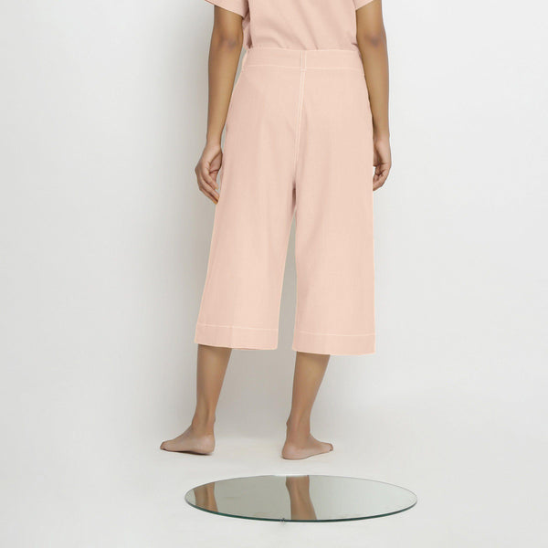 Back View of a Model wearing Vegetable Dyed Pink 100% Cotton Mid-Rise Culottes