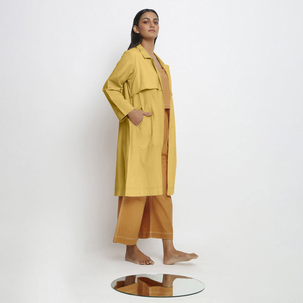 Right View of a Model wearing Vegetable-Dyed Yellow 100% Cotton Paneled Overlay