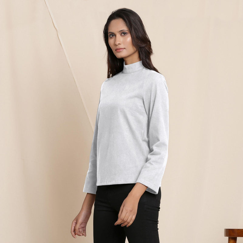 Left View of a Model wearing Warm Cloudy Grey Turtleneck Straight Top