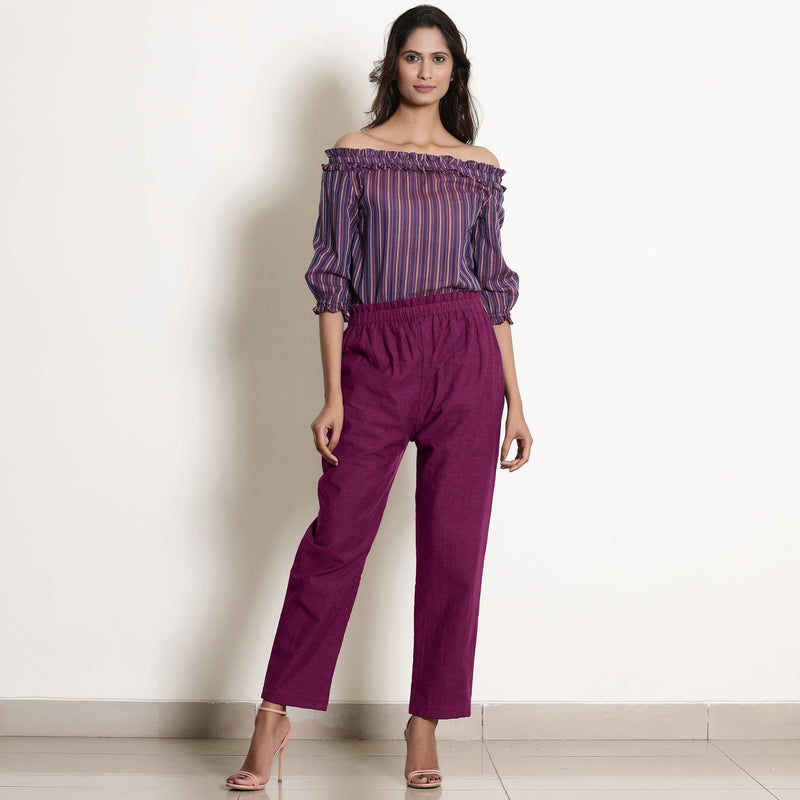 Front View of a Model wearing Warm Mulberry Frilled Waist Tapered Cotton Pant