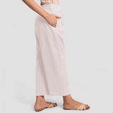 Right View of a Model wearing White Cotton Flax Wide Legged Pant