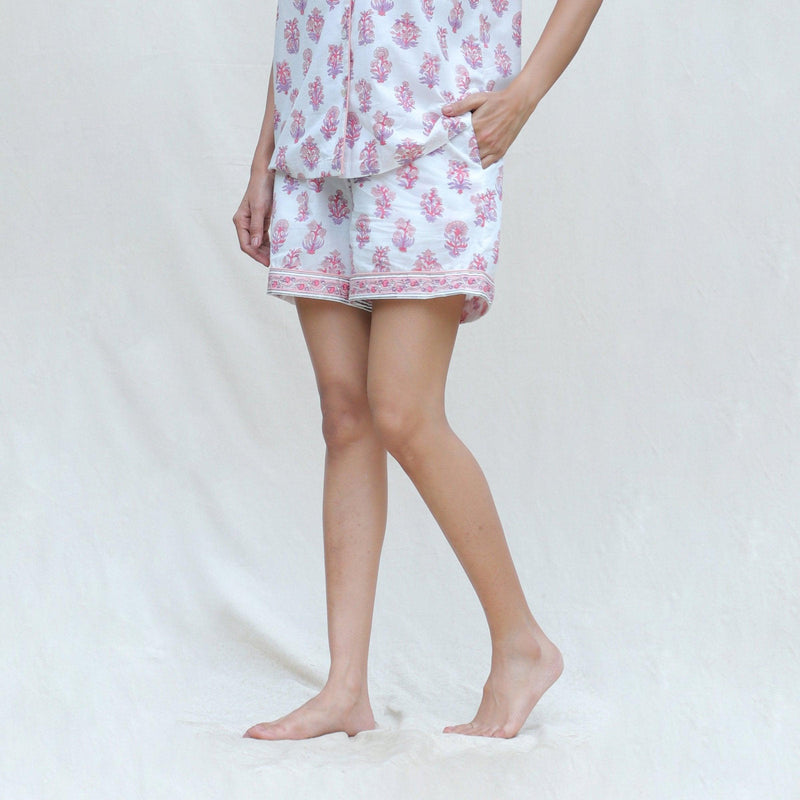 Left View of a Model wearing White and Fuchsia Block Printed Cotton High-Rise Elasticated Shorts