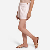 Left View of a Model wearing White Hand Beaded Short Cotton Shorts