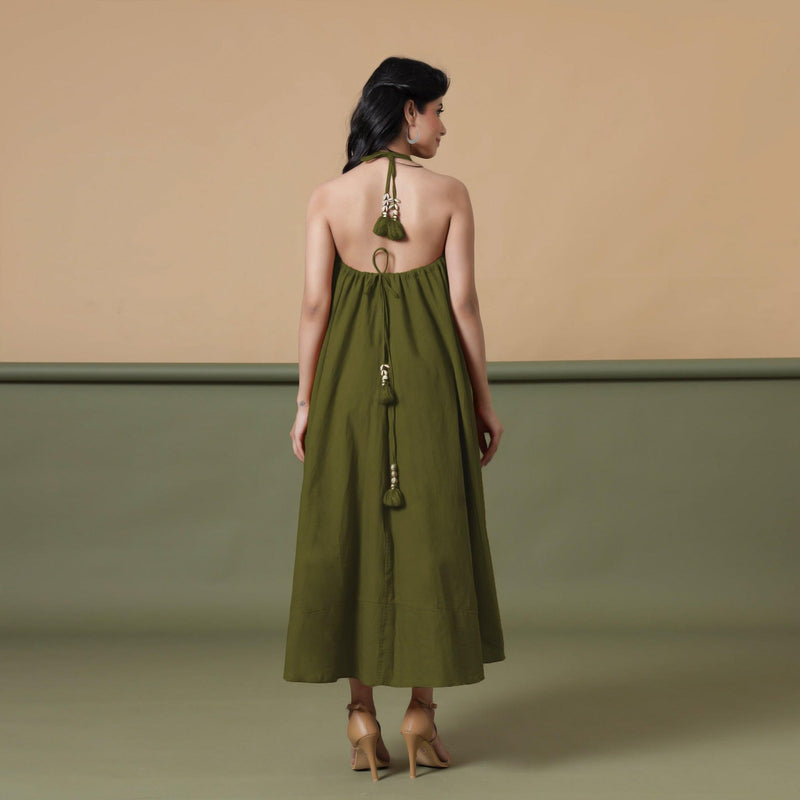 Back View of a Model wearing Convertible Olive Green Shibori Tie Dye 6-Way Skirt Dress