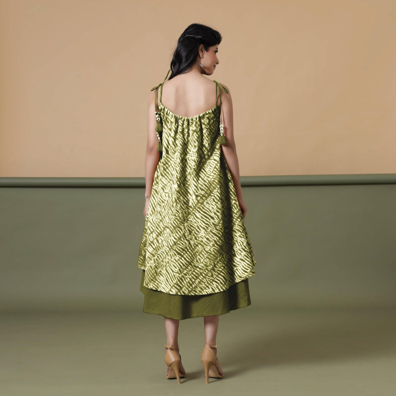 Back View of a Model wearing Convertible Olive Green Shibori Tie Dye 6-Way Skirt Dress