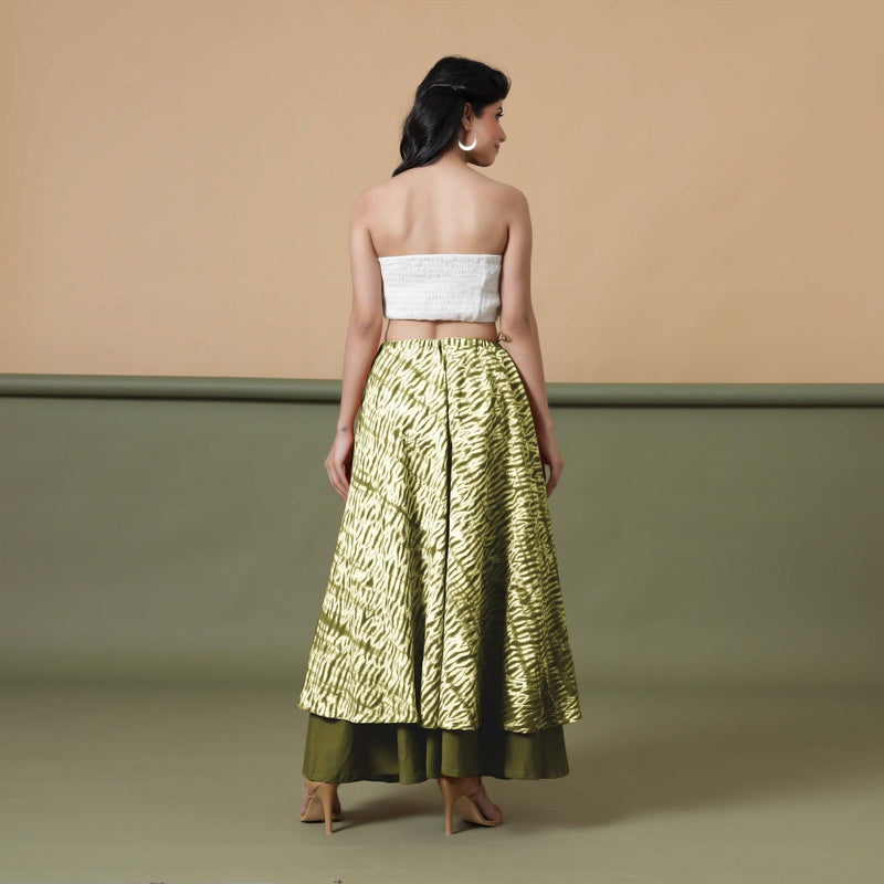 Back View of a Model wearing Convertible Olive Green Shibori Tie Dye 6-Way Skirt Dress